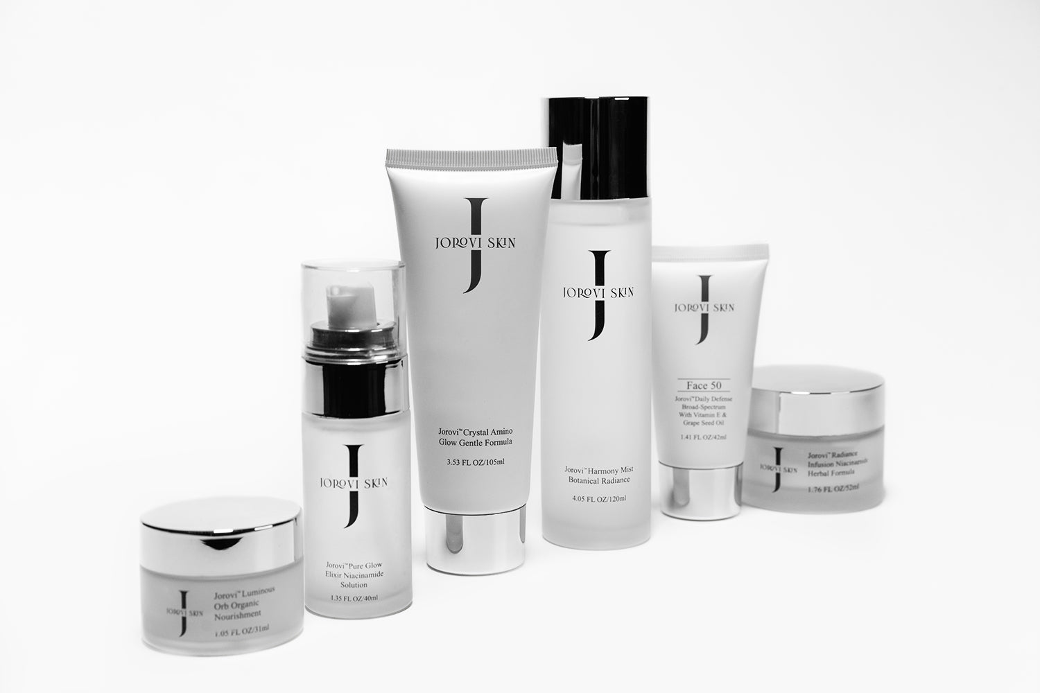 Arrangement of Jorovi Skin’s skincare beauty set, including moisturizers, serums, and creams enriched with natural extracts and advanced peptides for anti-aging and skin rejuvenation.